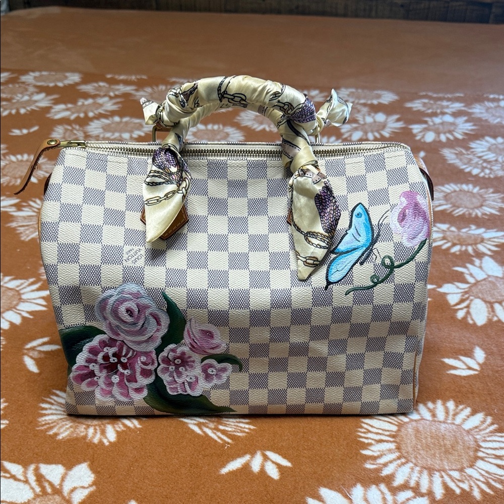 Louis Vuitton Speedy 30 Top-Handle Bag in Cream with Pink Accents.